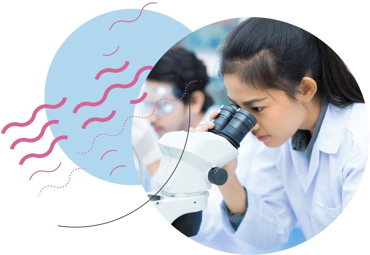 A female university student looking through a microscope.